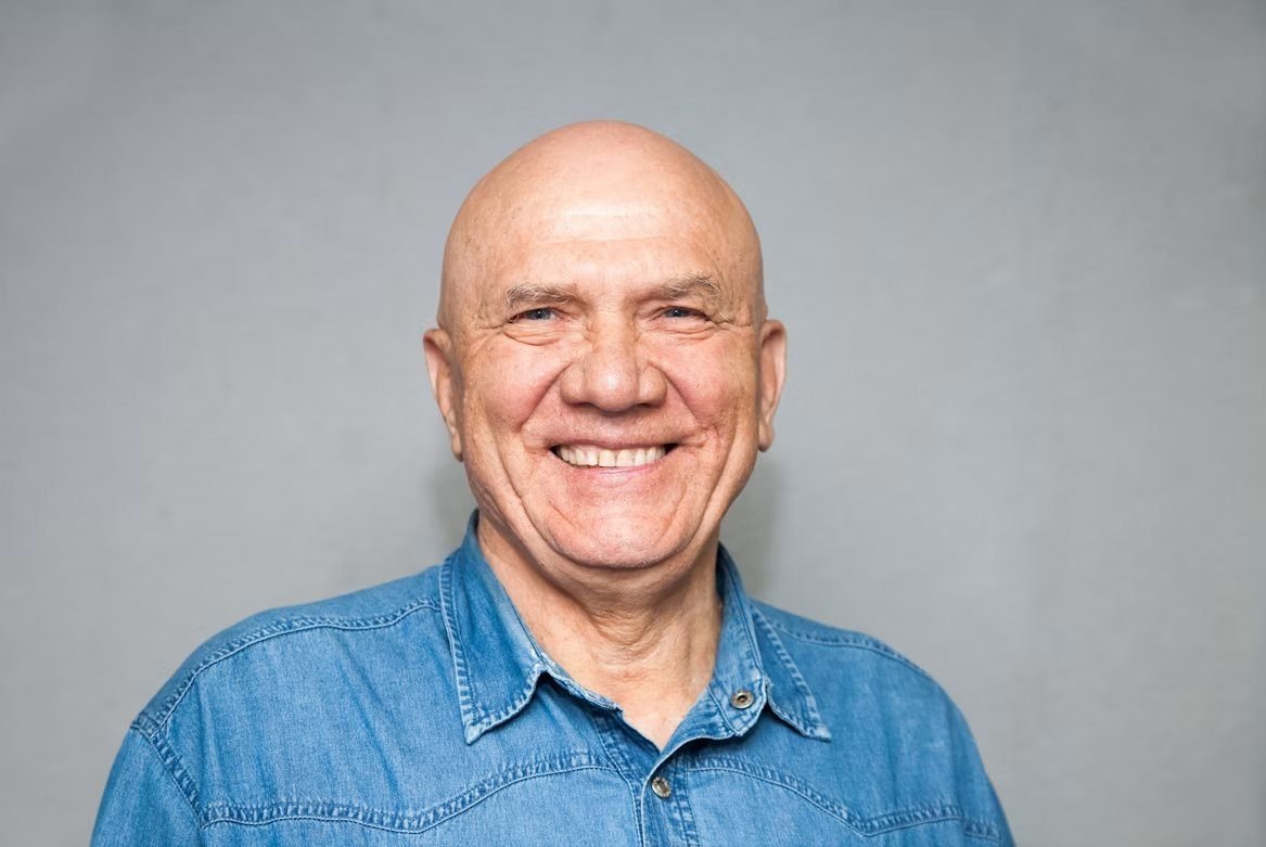 A smiling client of CAV Denture Clinic